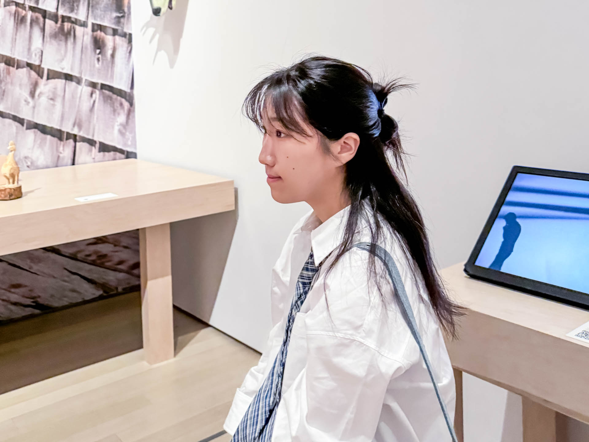 profile photo of Woman with long hair and white shirt