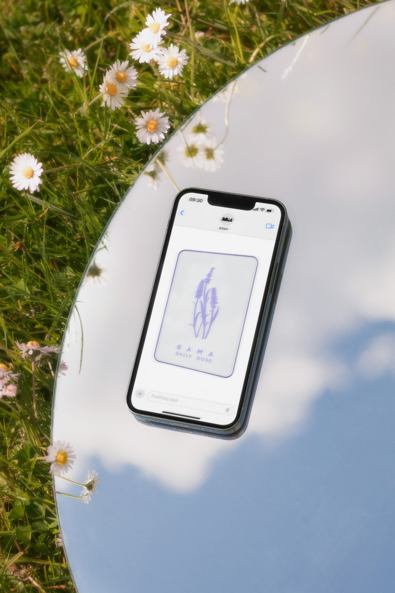 an outdoor shot of a phone on a mirror, which reflects the clouds.