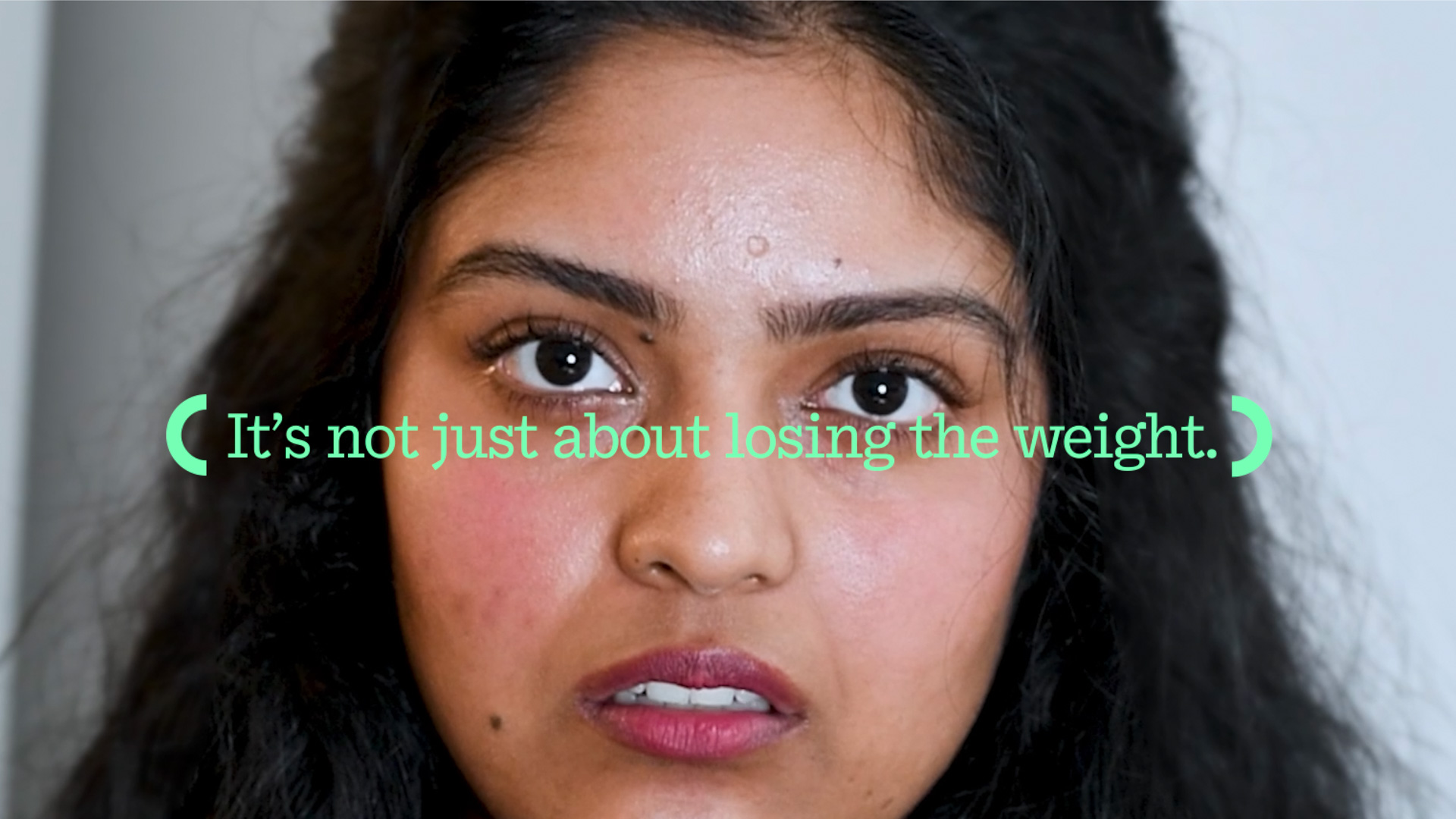 a woman of Indian descent looks straight at the camera with text below that says It's not just about losing the weight