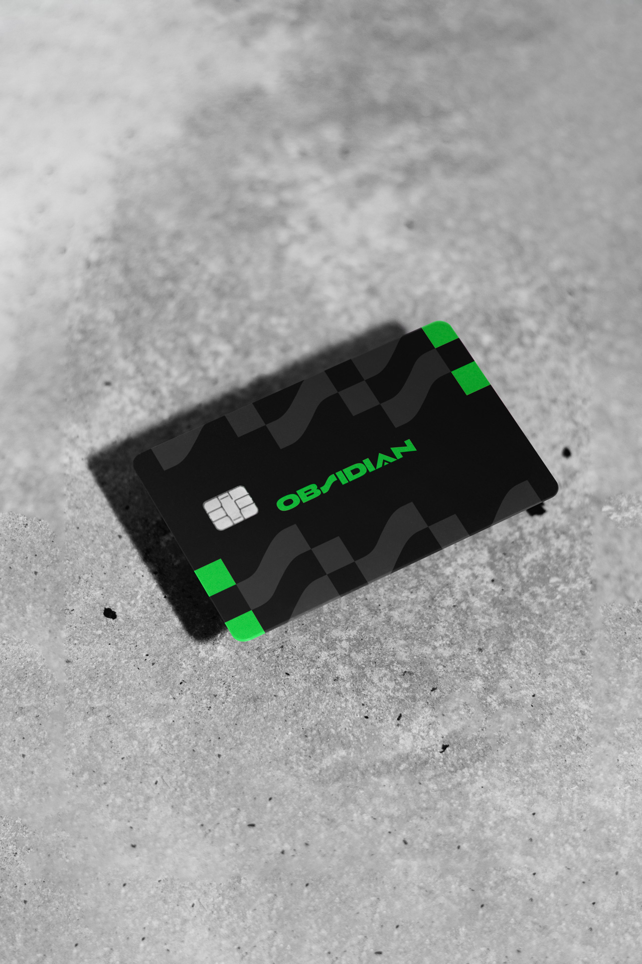 a dark plastic credit card with the word Obsidian on it