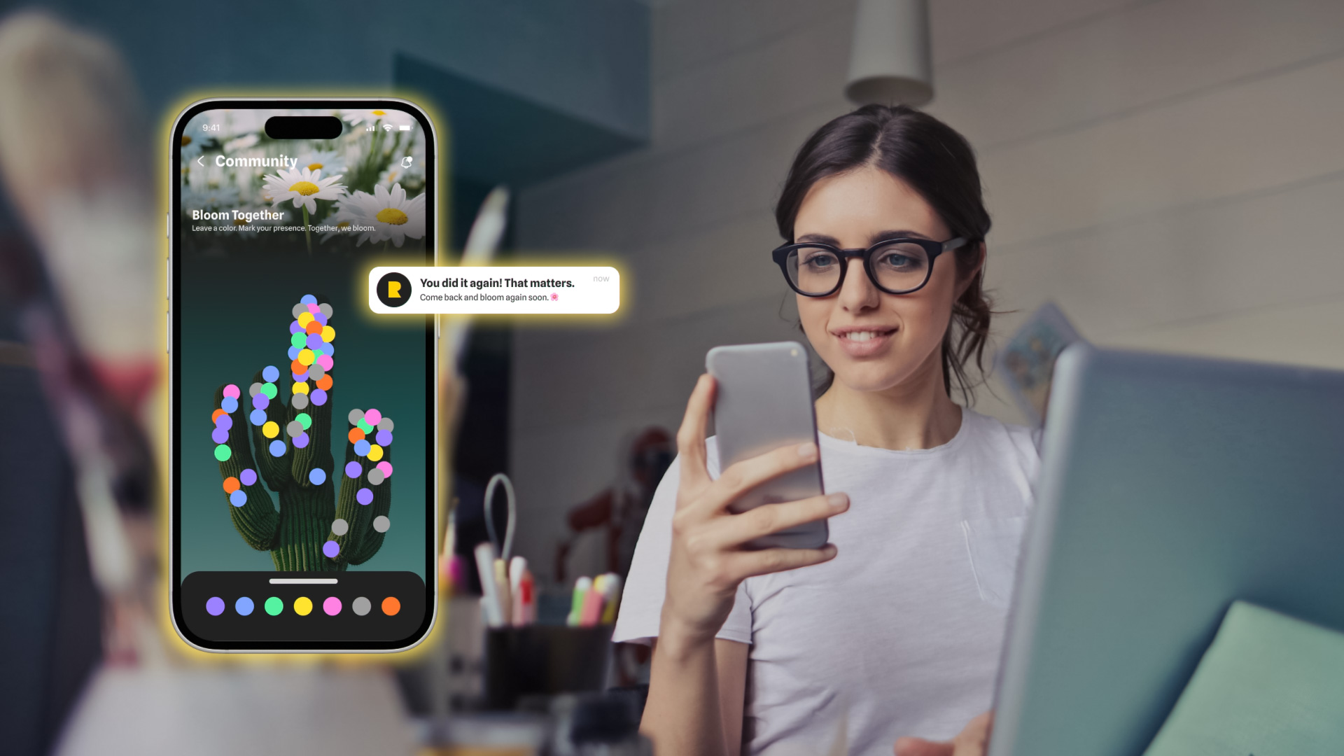 woman with glasses holding a phone and looking at an advertisement