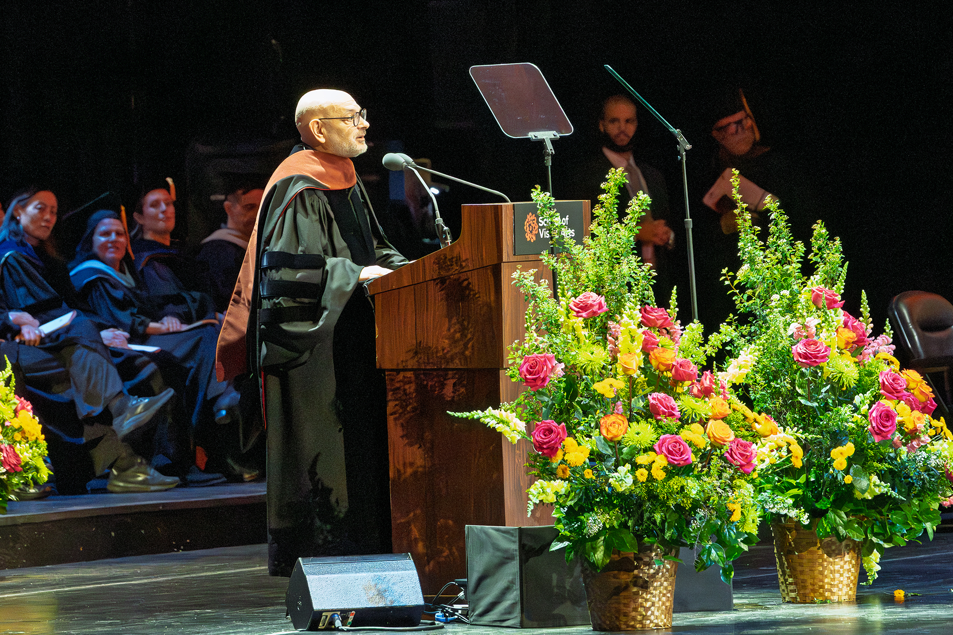 a man gives a speech at a podium