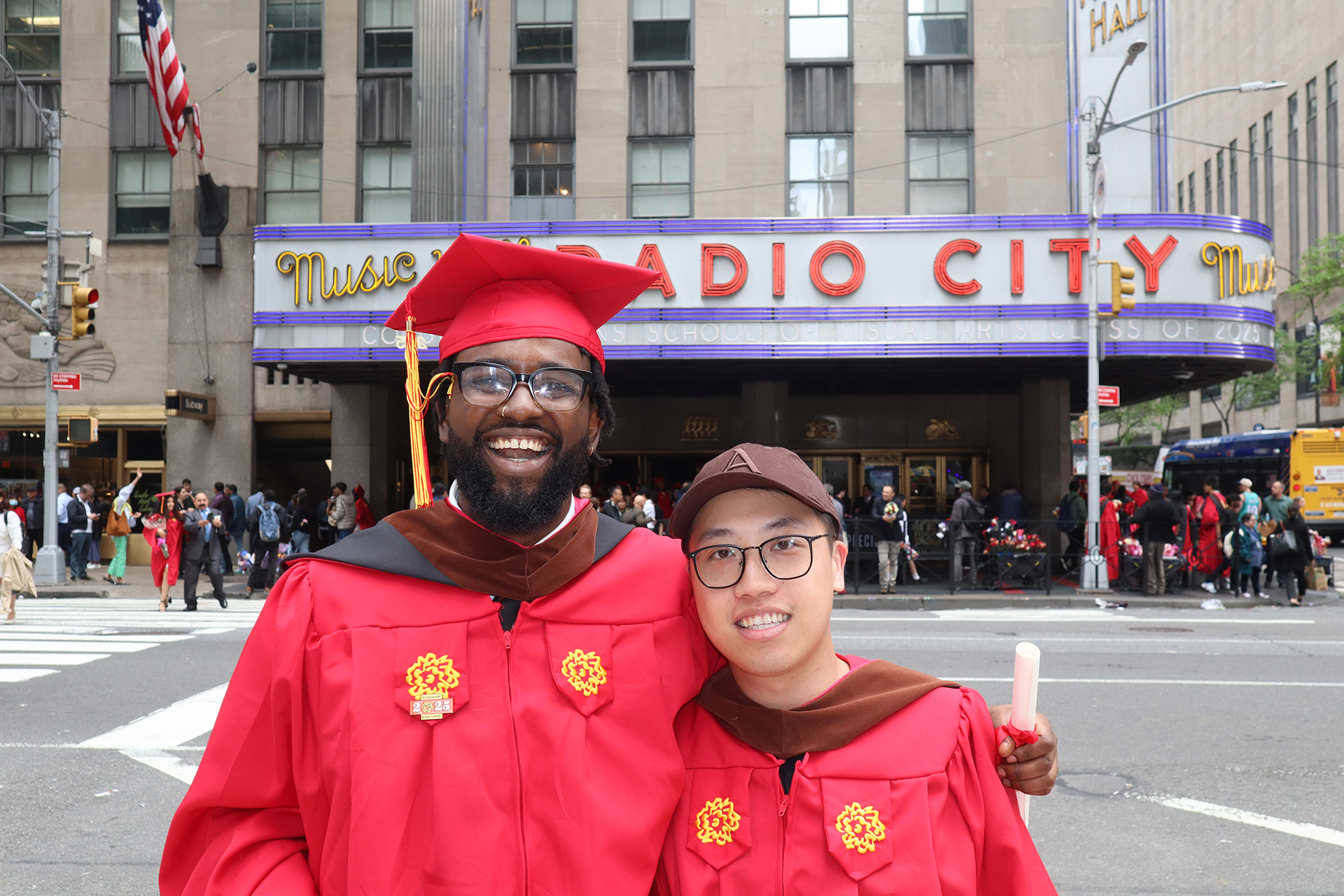 two students outside posing for the camera