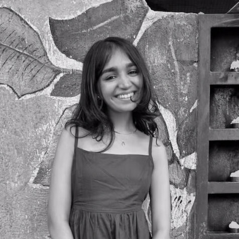 portrait of Anushri, black and white smiling woman - square
