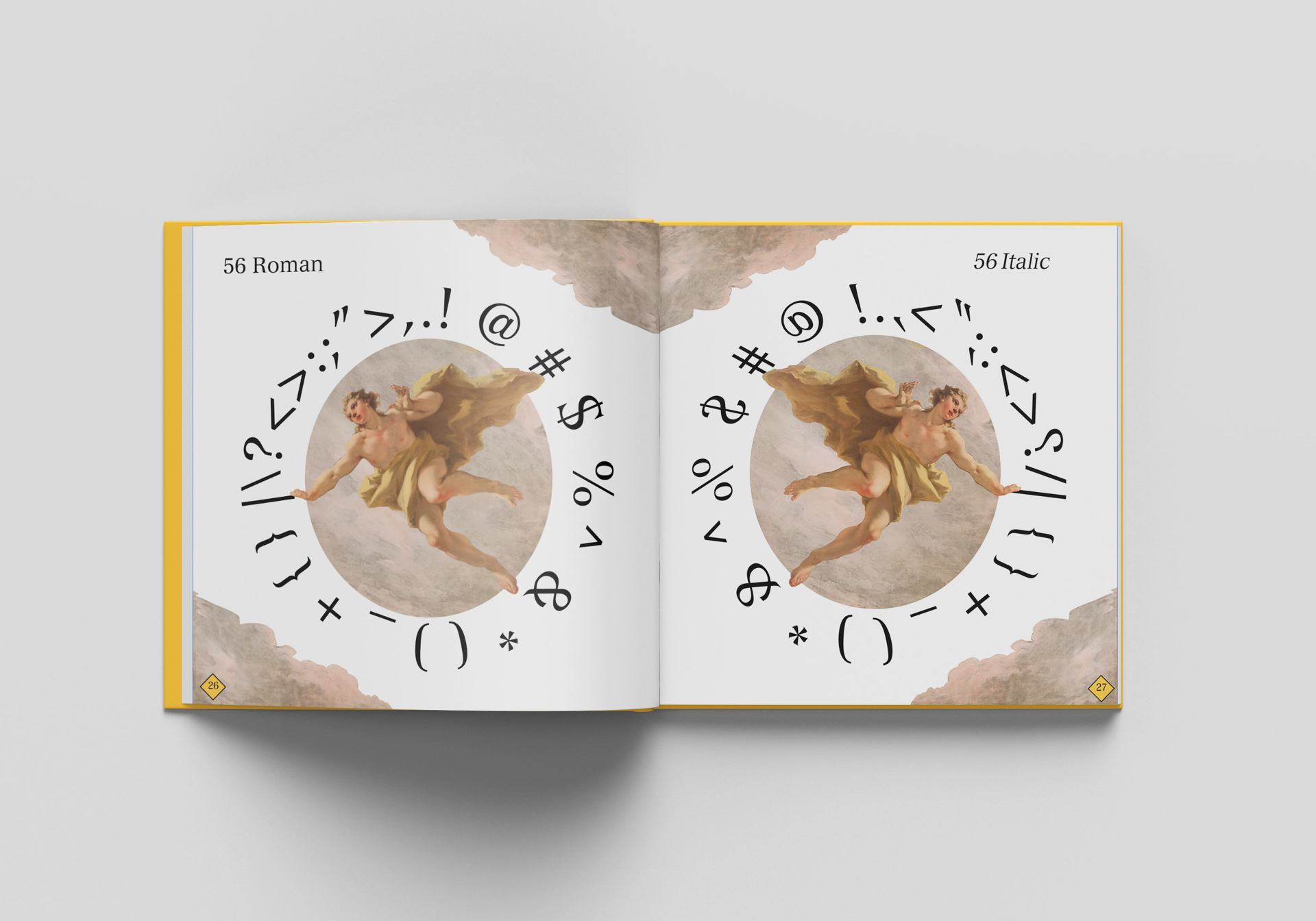book open on a white table showing illustrations and symbols