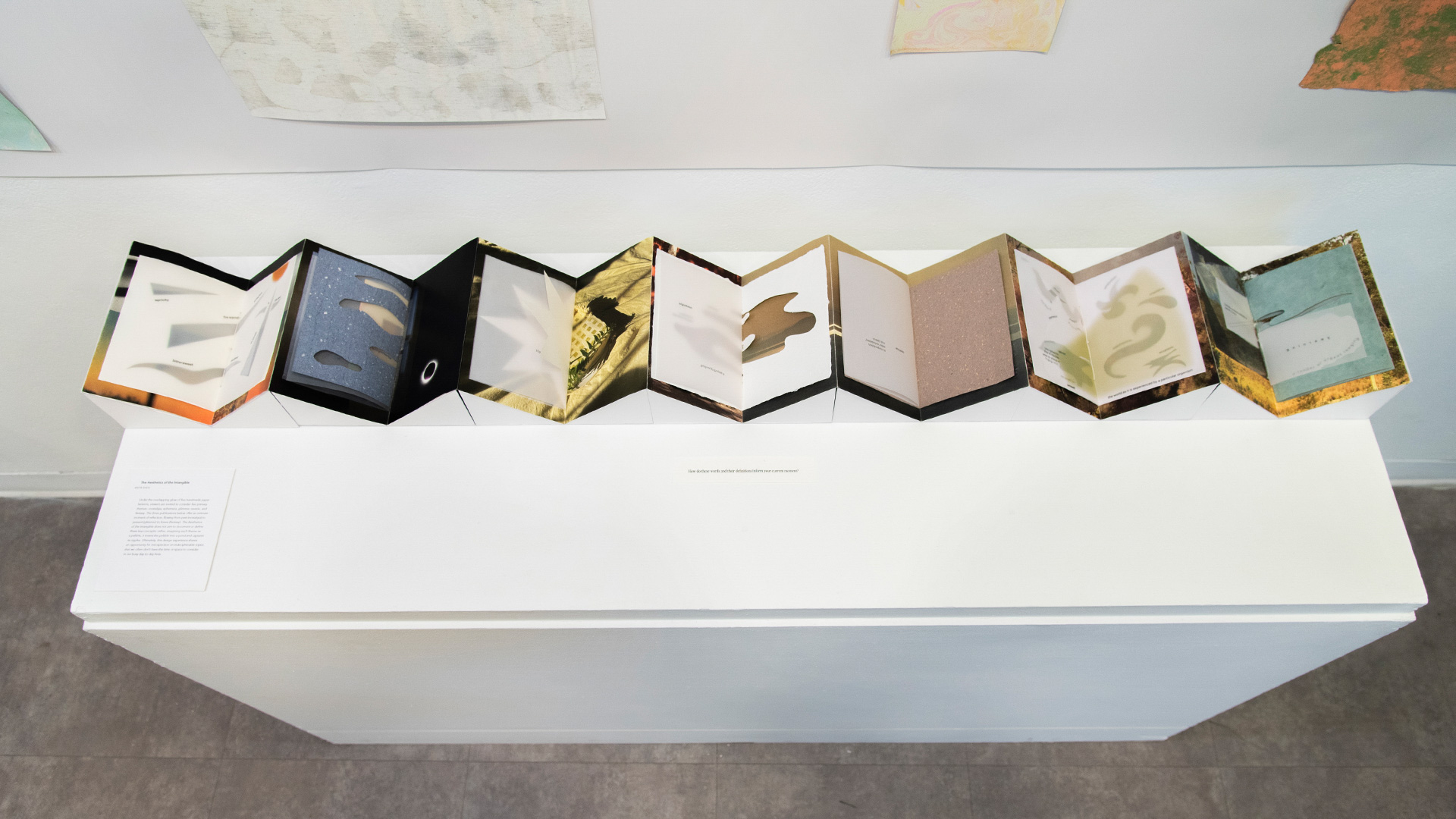 accordion book open for display on a pedestal