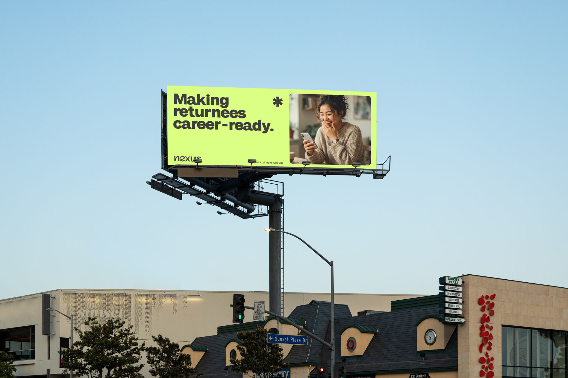 Billboard advertisement reading “Making returnees career-ready” beside a smiling woman looking at her phone against a pale green background.