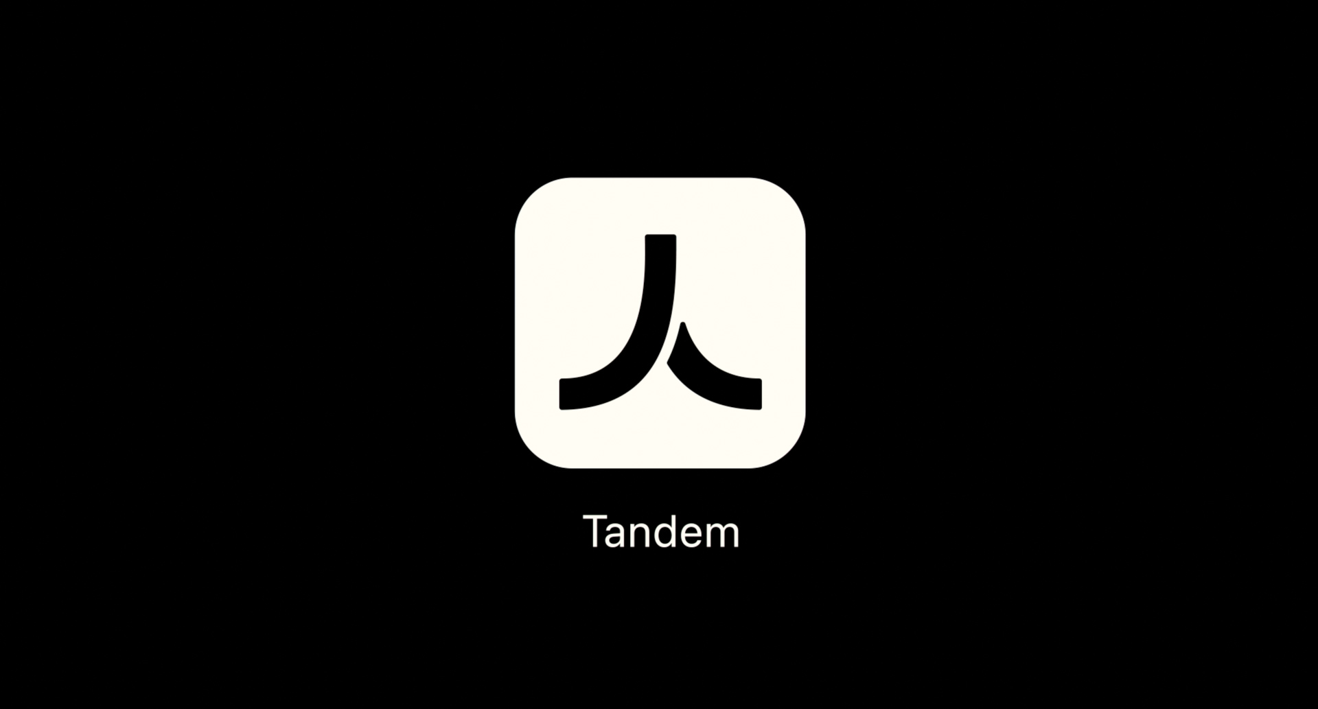 Minimal black screen displaying the Tandem app icon and logo centered on screen.